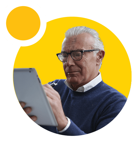 A landlord with glasses using a tablet.
